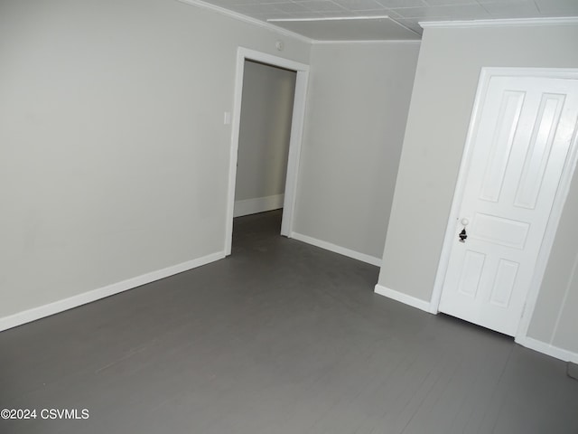 empty room featuring ornamental molding