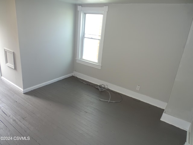 empty room with dark hardwood / wood-style floors