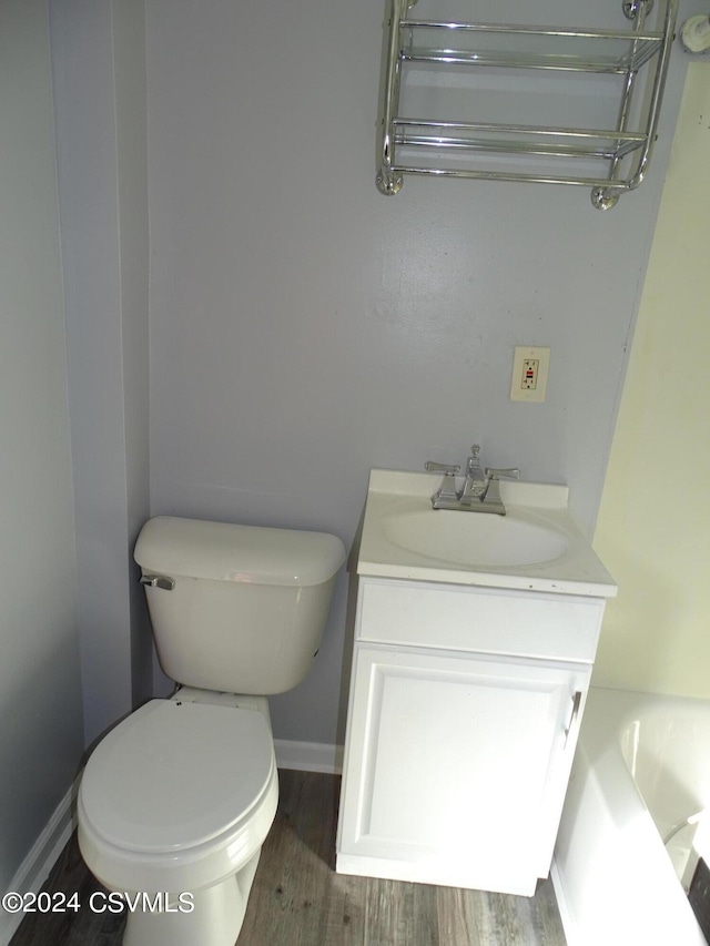 310 W 3rd St, Mount Carmel, PA 17851 - bathroom with vanity, baseboards, wood finished floors, and toilet