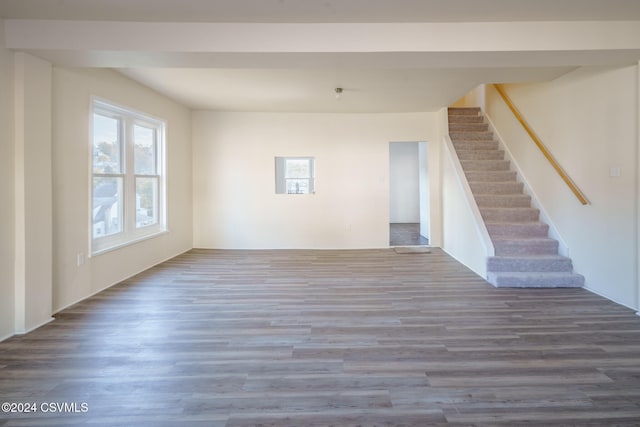 unfurnished living room with dark hardwood / wood-style floors