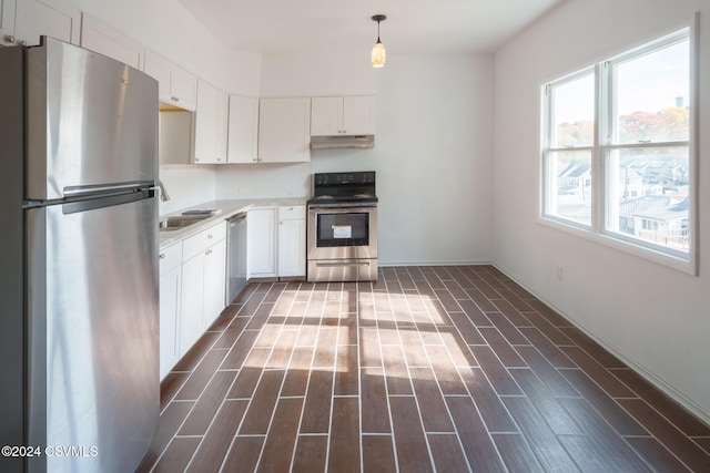 1766 W Chestnut St, Coal Township, PA 17866 - kitchen featuring stainless steel appliances, under cabinet range hood, white cabinets, and light countertops