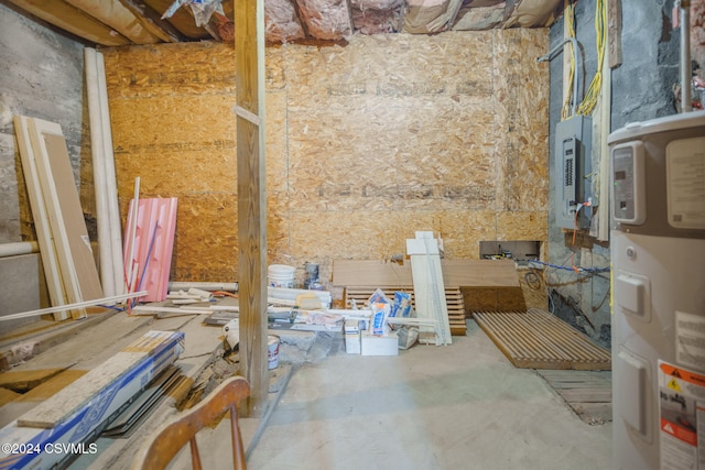 miscellaneous room with water heater and concrete flooring