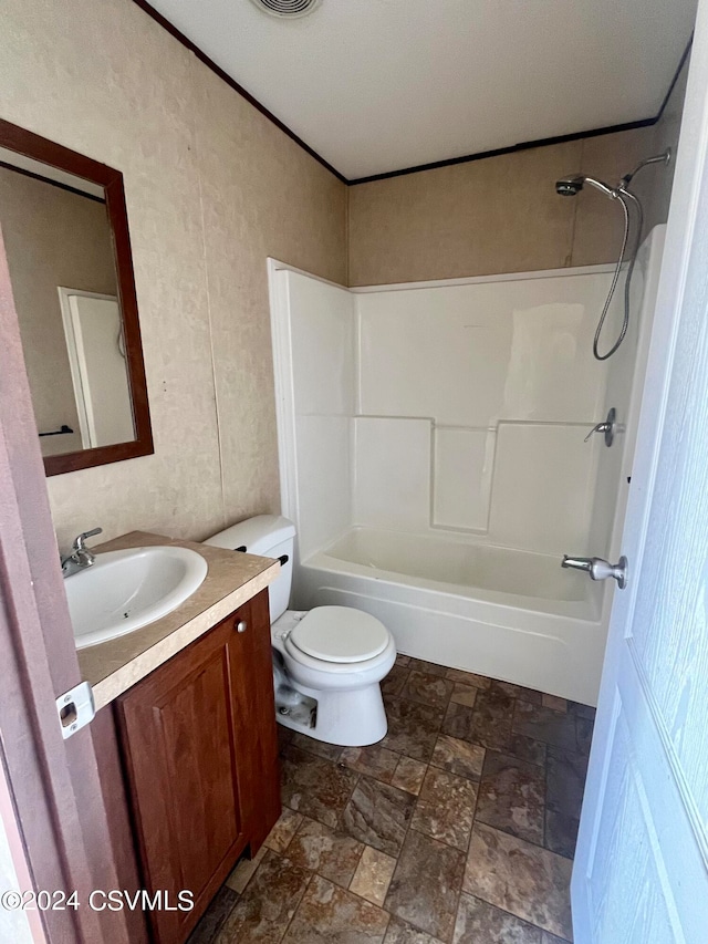 full bathroom with vanity, shower / tub combination, and toilet