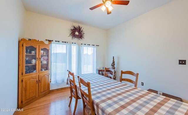 dining space featuring ceiling fan and light wood-type flooring