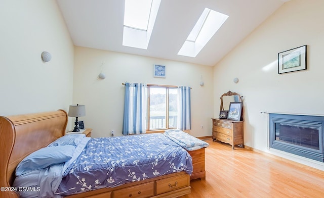 bedroom with lofted ceiling and hardwood / wood-style floors