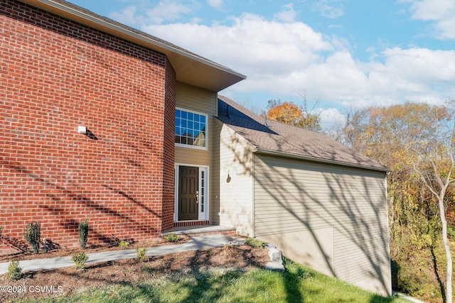 exterior space with brick siding