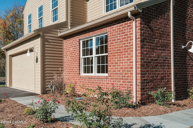 view of side of home with a garage