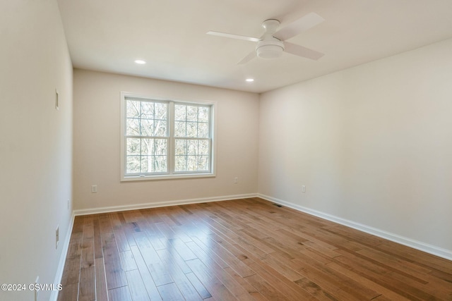 unfurnished room featuring baseboards, recessed lighting, ceiling fan, and wood finished floors