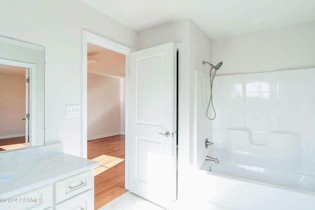 bathroom with vanity and washtub / shower combination