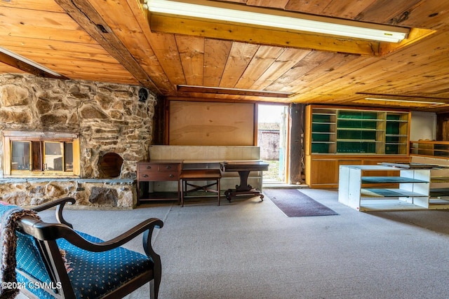 living area featuring carpet flooring and wooden ceiling