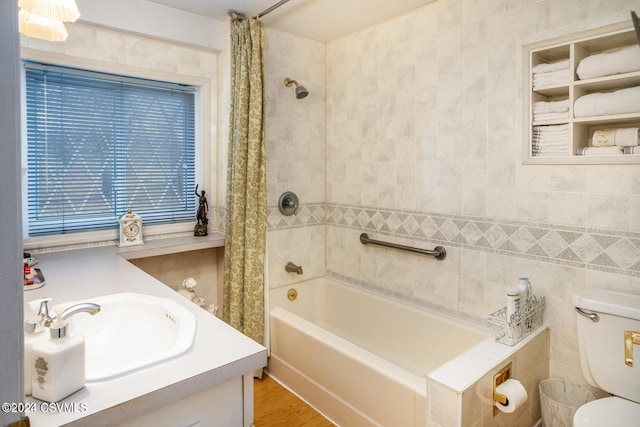 full bathroom with vanity, toilet, hardwood / wood-style flooring, and shower / bath combo with shower curtain