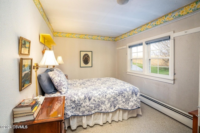 bedroom with carpet flooring and baseboard heating