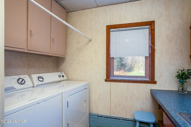 laundry area with cabinets and washer and clothes dryer