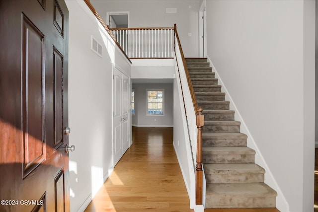 stairway featuring hardwood / wood-style floors