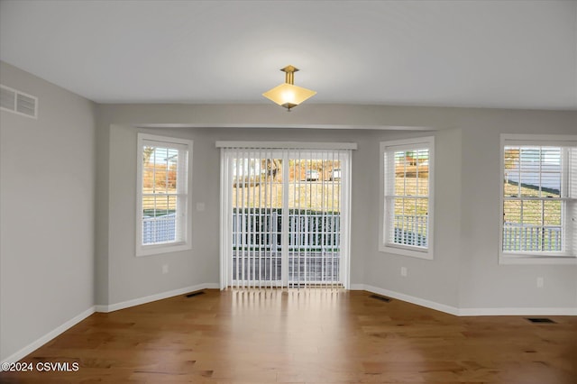 empty room featuring hardwood / wood-style floors