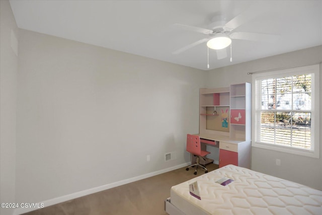 bedroom with ceiling fan and carpet flooring