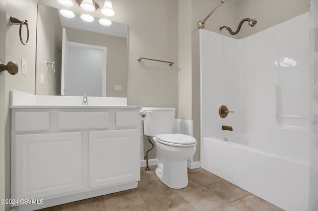 full bathroom featuring vanity, tile patterned floors, toilet, and shower / bathtub combination