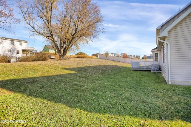 view of yard featuring a wooden deck