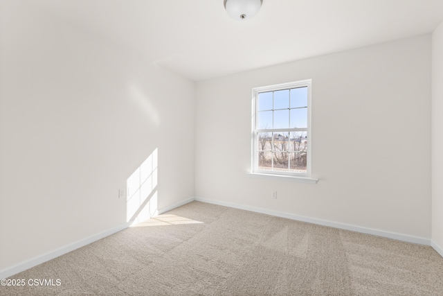 unfurnished room with light colored carpet