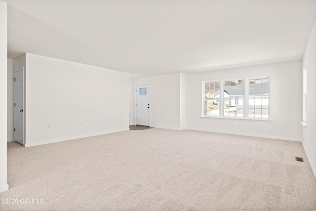 unfurnished room with light carpet