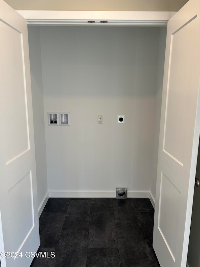 laundry area featuring washer hookup, dark tile patterned flooring, and electric dryer hookup