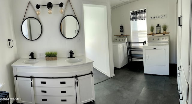 bathroom featuring vanity and washing machine and dryer