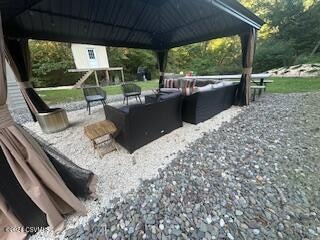 view of patio / terrace with a gazebo and an outdoor hangout area