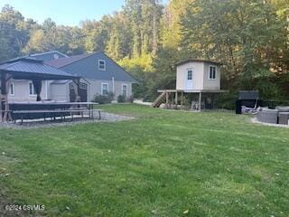 view of yard with a gazebo and a storage shed