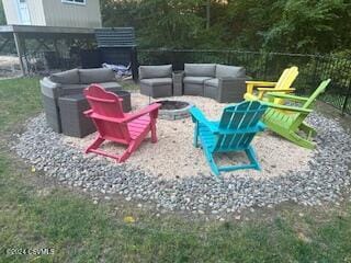 view of patio / terrace with an outdoor living space with a fire pit