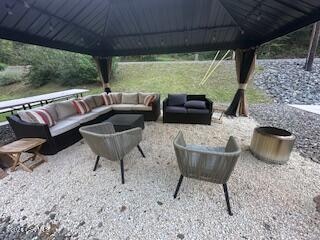 view of patio featuring a gazebo and outdoor lounge area