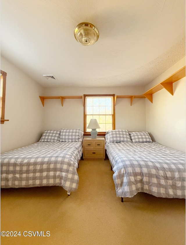 bedroom featuring light colored carpet