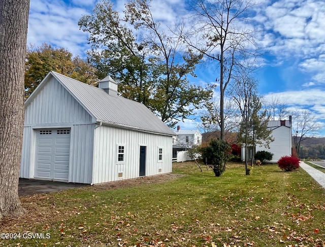 garage with a yard