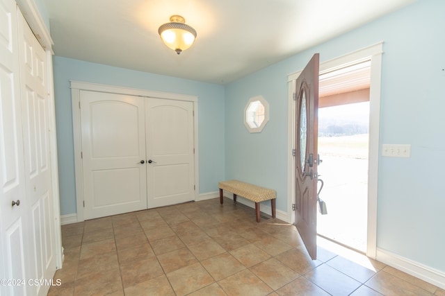 entryway featuring light tile patterned floors