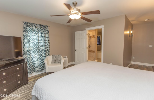 bedroom with ceiling fan, connected bathroom, and dark hardwood / wood-style flooring