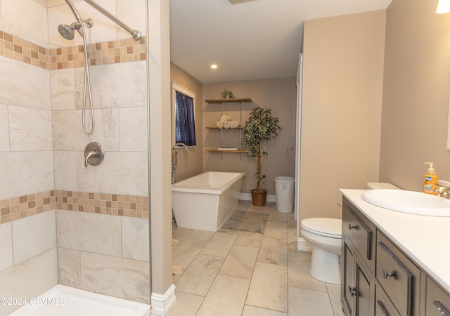 bathroom featuring vanity, toilet, and tiled shower