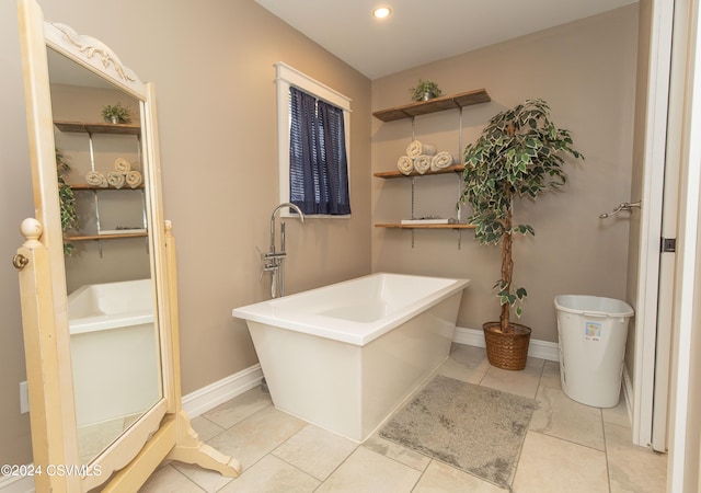 bathroom featuring a tub to relax in and tile patterned floors