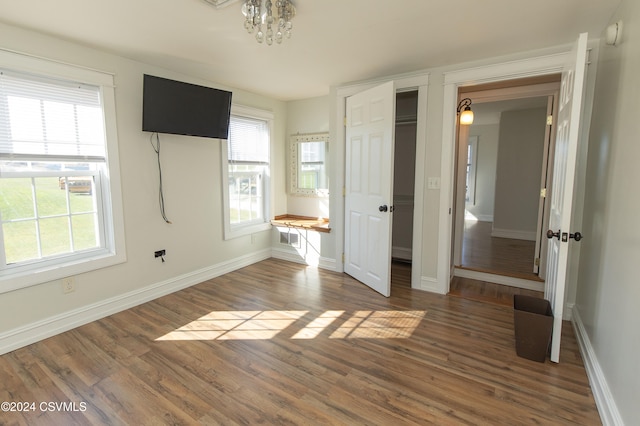 unfurnished bedroom with dark hardwood / wood-style floors