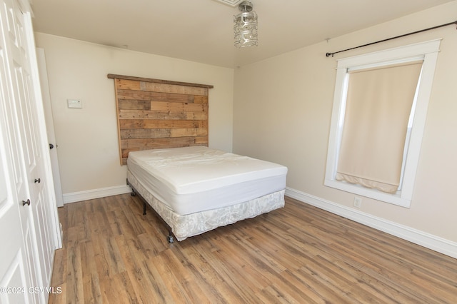 bedroom featuring wood-type flooring