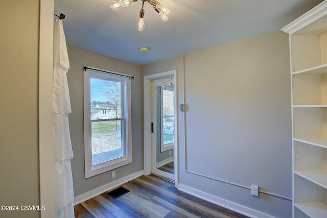 doorway to outside with dark hardwood / wood-style flooring