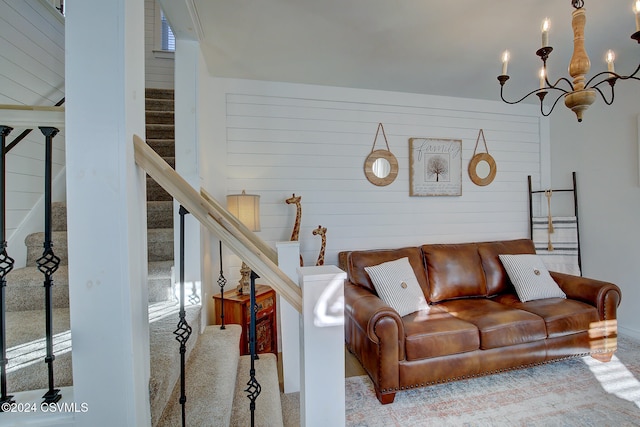 carpeted living room featuring a chandelier and a wealth of natural light