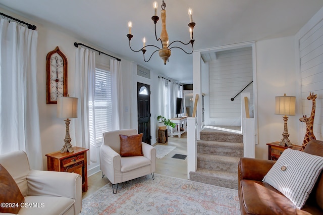 living area with a notable chandelier