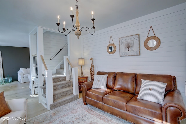 living room featuring light hardwood / wood-style flooring and a chandelier