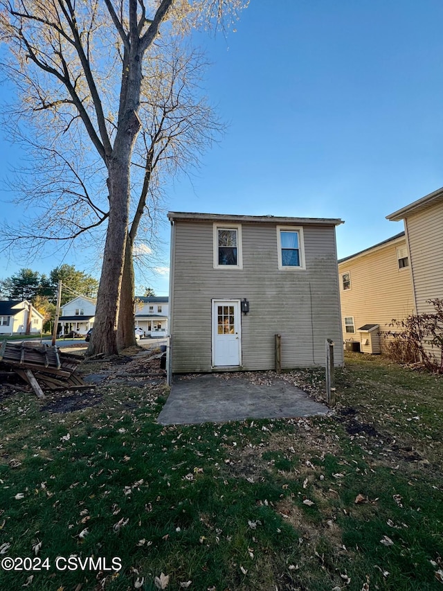 back of house with a patio