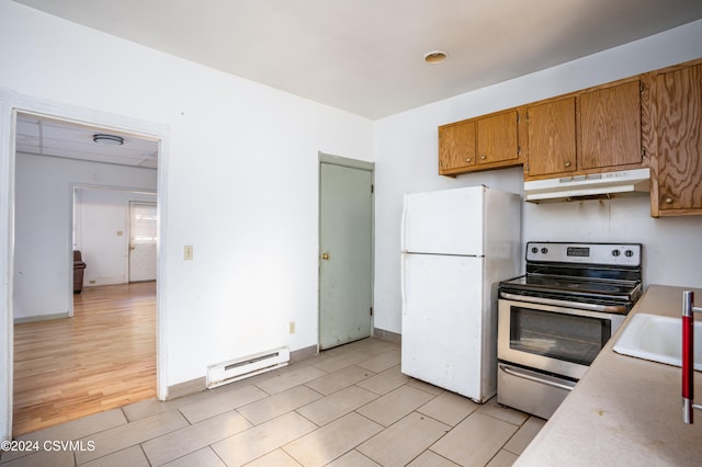 kitchen featuring stainless steel range with electric cooktop, sink, baseboard heating, white fridge, and light wood-type flooring