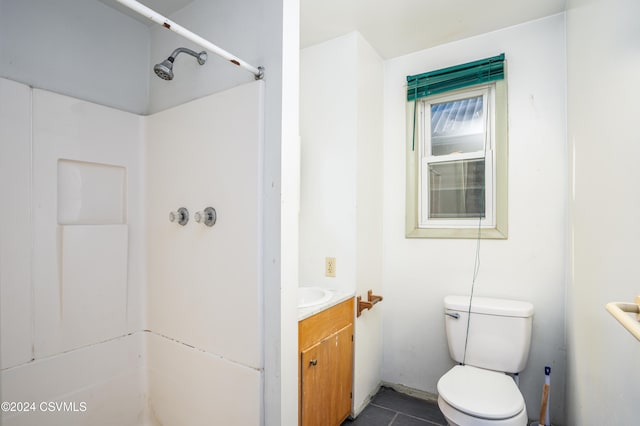 bathroom with tile patterned floors, vanity, and toilet