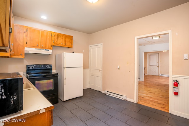 kitchen featuring black range with electric stovetop, dark hardwood / wood-style flooring, a baseboard heating unit, and white refrigerator