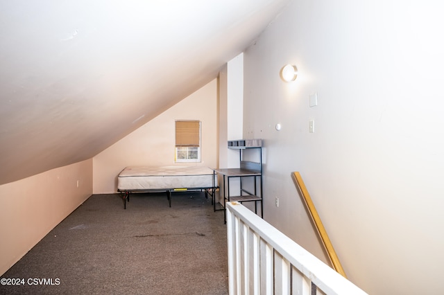 bonus room with carpet flooring and lofted ceiling