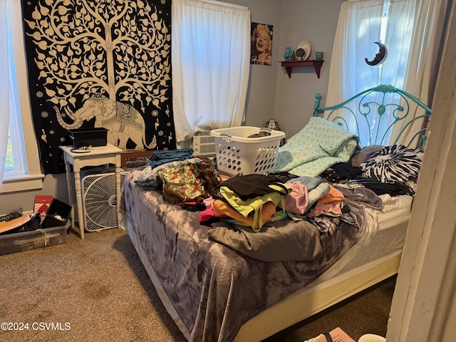 carpeted bedroom with cooling unit