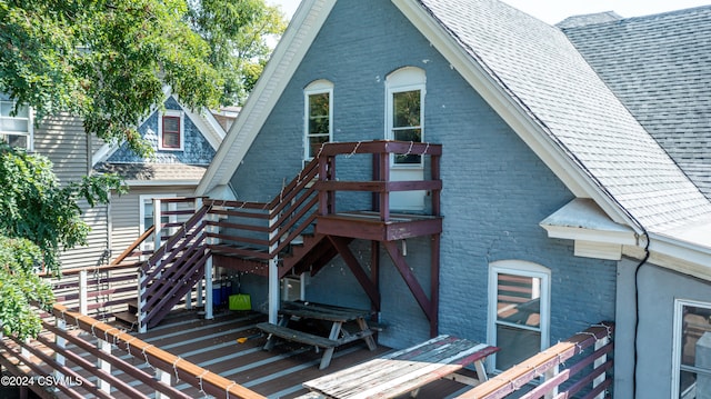 rear view of house featuring a deck