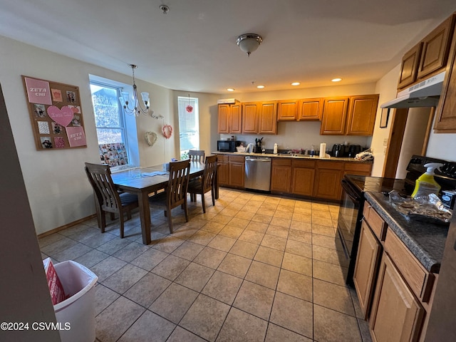 kitchen featuring black appliances, a notable chandelier, pendant lighting, and light tile patterned floors